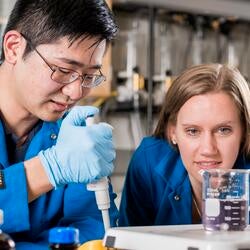 student and faculty in lab